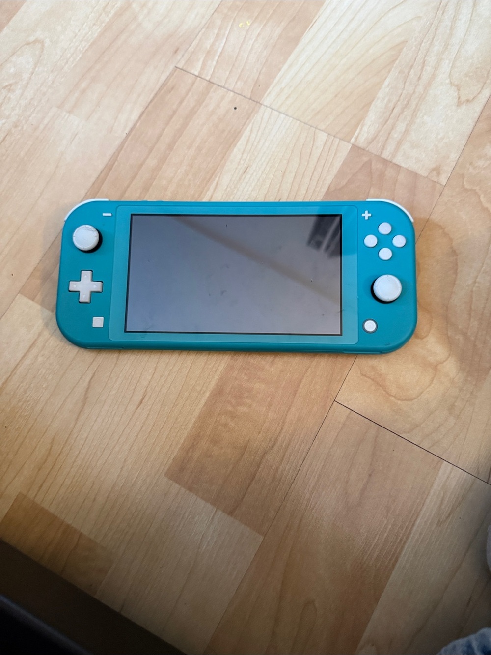 Nintendo Switch Lite Teal Handheld Console with White Buttons